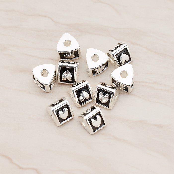 Triangle Cube Initial Metal Bead, 2 Pc on warm marble background (PD.1136)