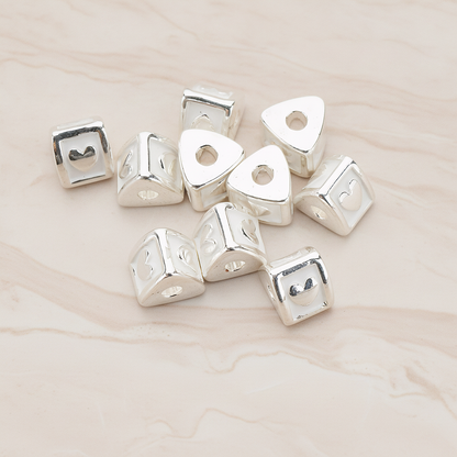 Triangle Cube Initial Metal Bead, 2 Pc on warm marble background (PD.1136)
