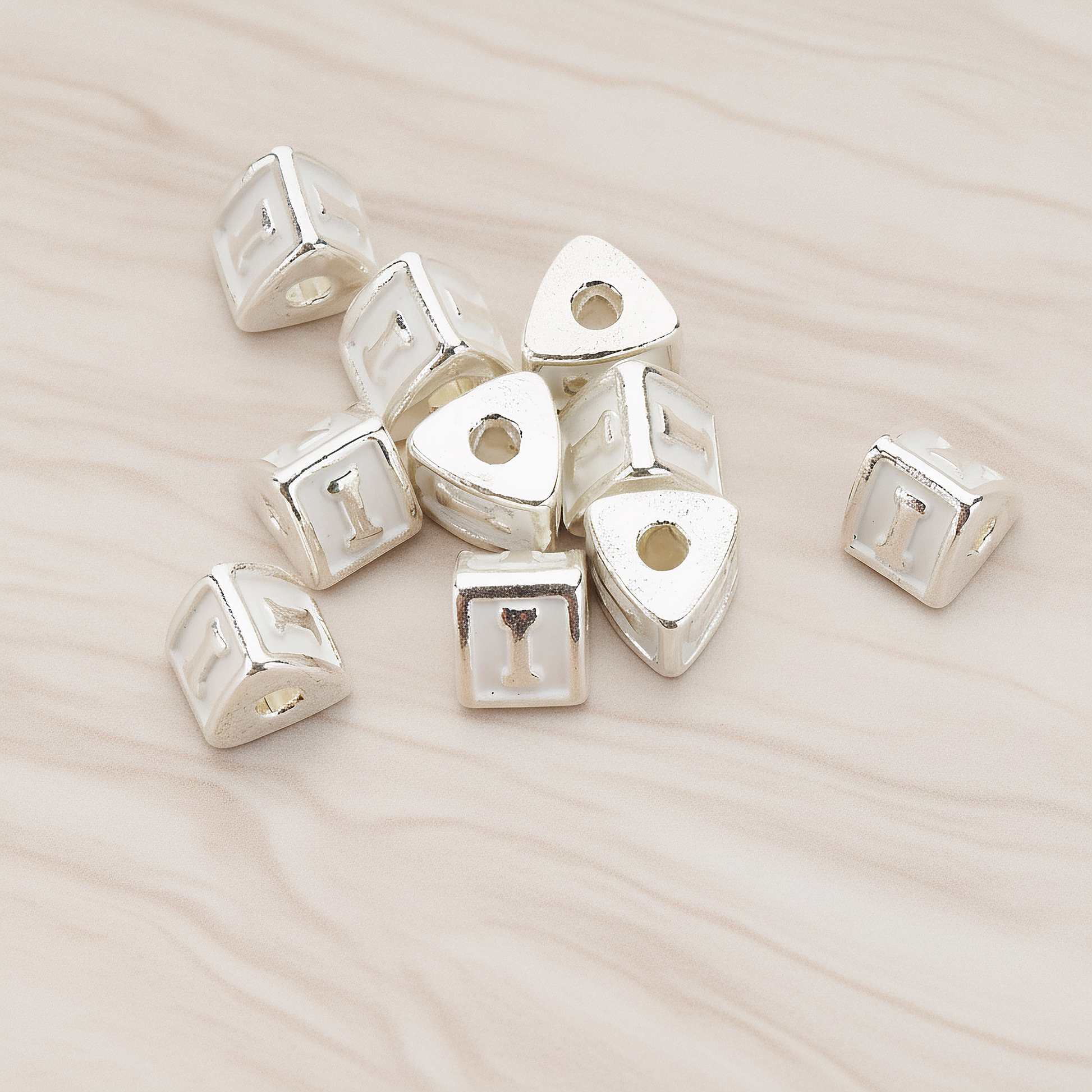 Triangle Cube Initial Metal Bead, 2 Pc on warm marble background (PD.1136)