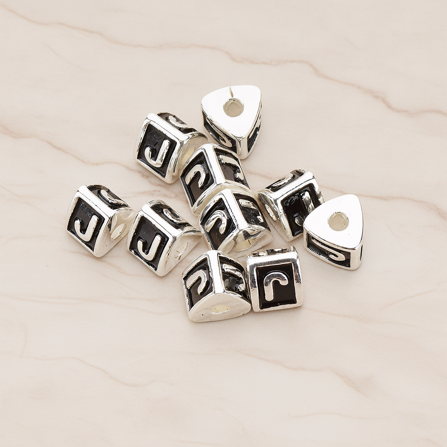 Triangle Cube Initial Metal Bead, 2 Pc on warm marble background (PD.1136)