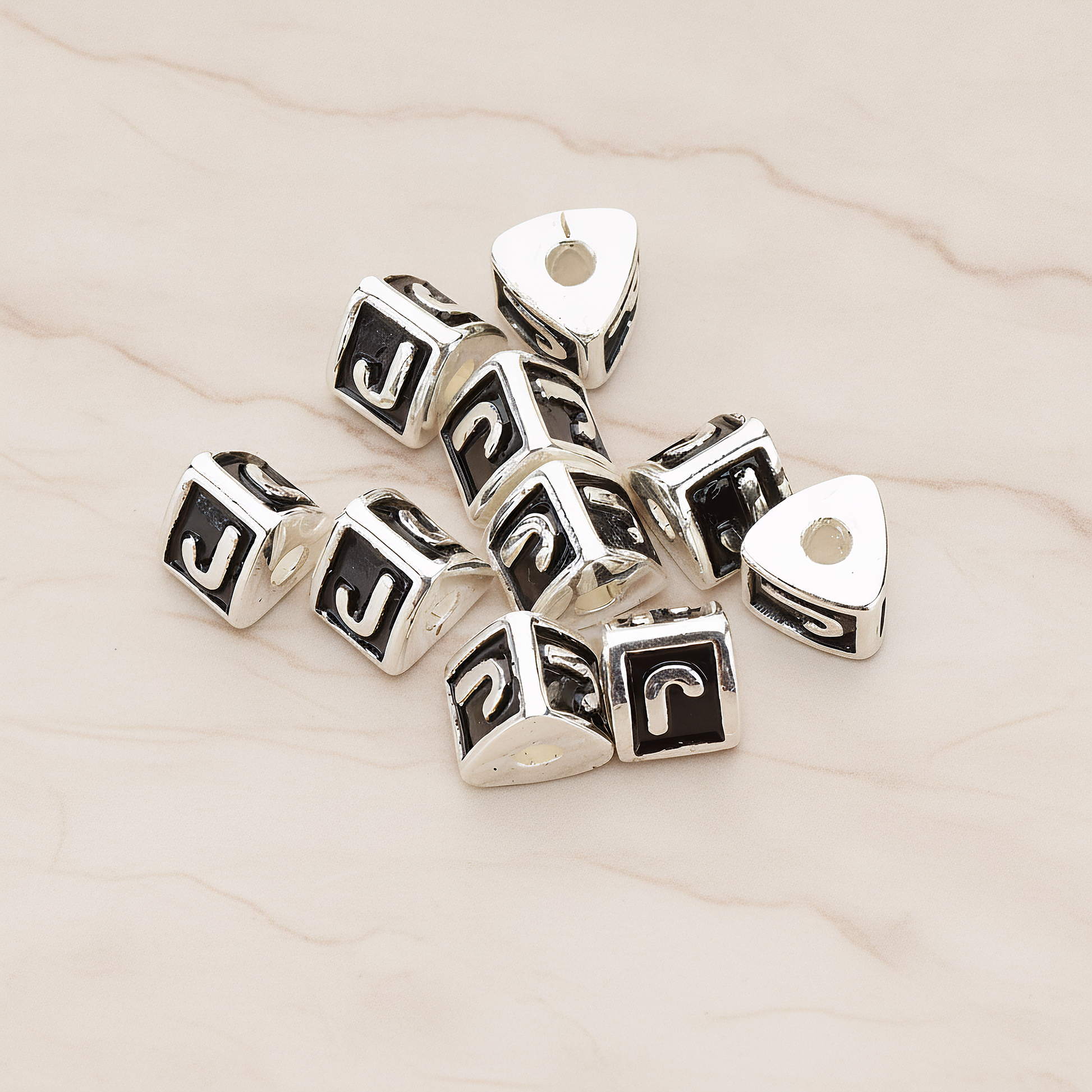 Triangle Cube Initial Metal Bead, 2 Pc on warm marble background (PD.1136)