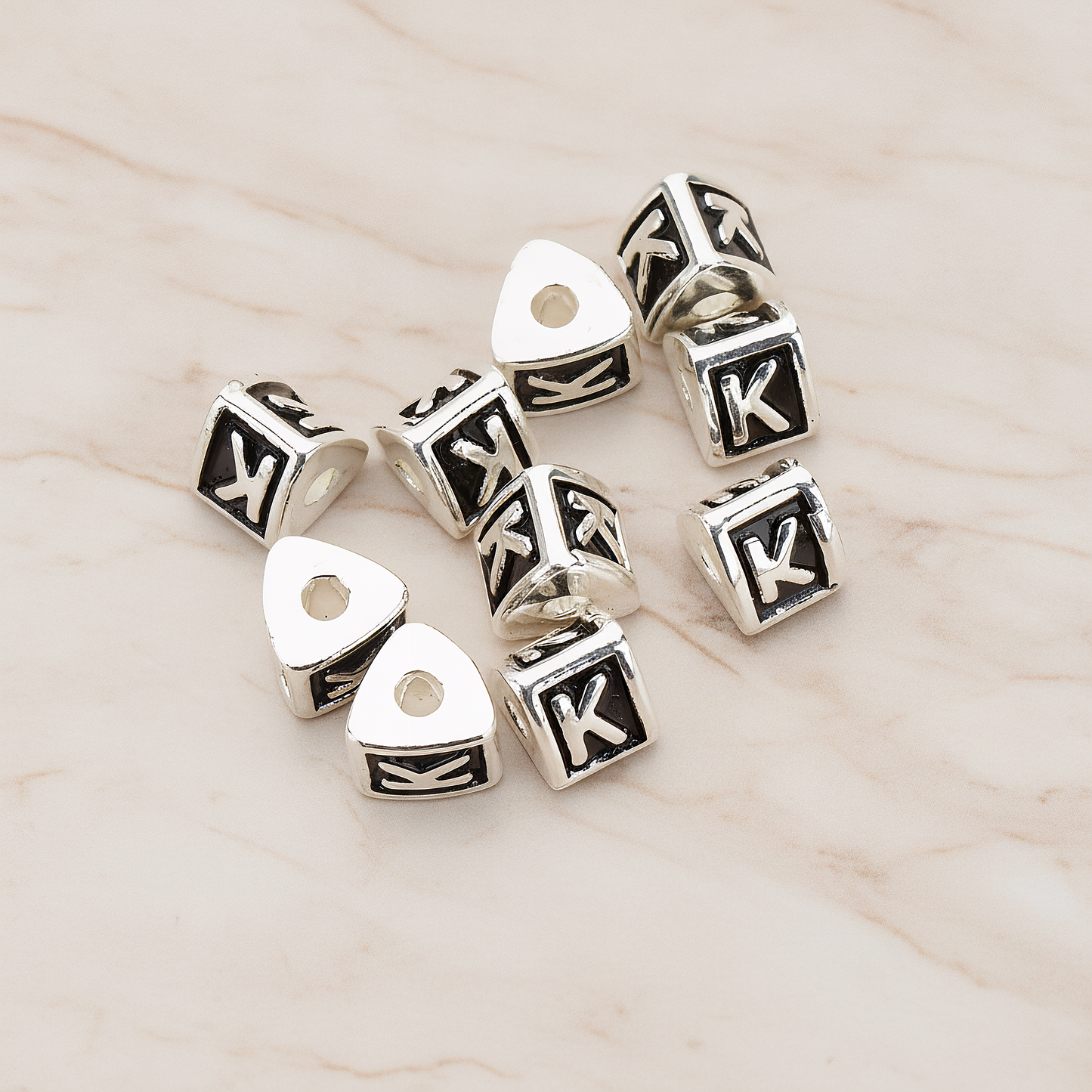 Triangle Cube Initial Metal Bead, 2 Pc on warm marble background (PD.1136)