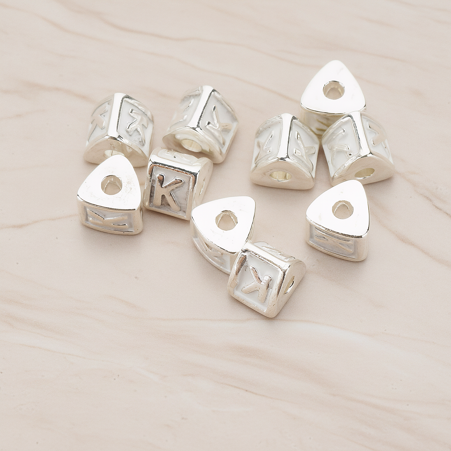 Triangle Cube Initial Metal Bead, 2 Pc on warm marble background (PD.1136)
