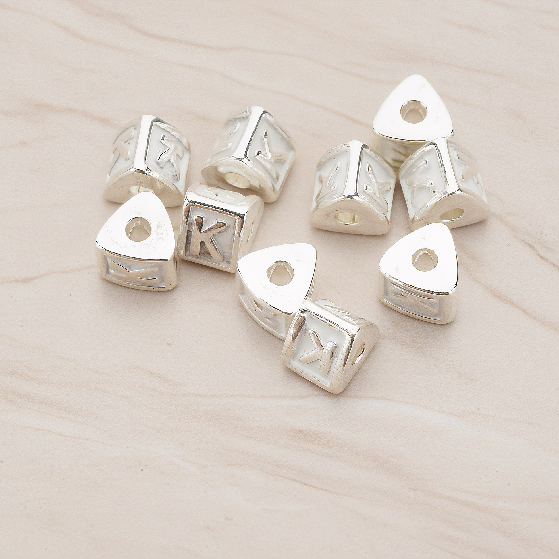 Triangle Cube Initial Metal Bead, 2 Pc on warm marble background (PD.1136)