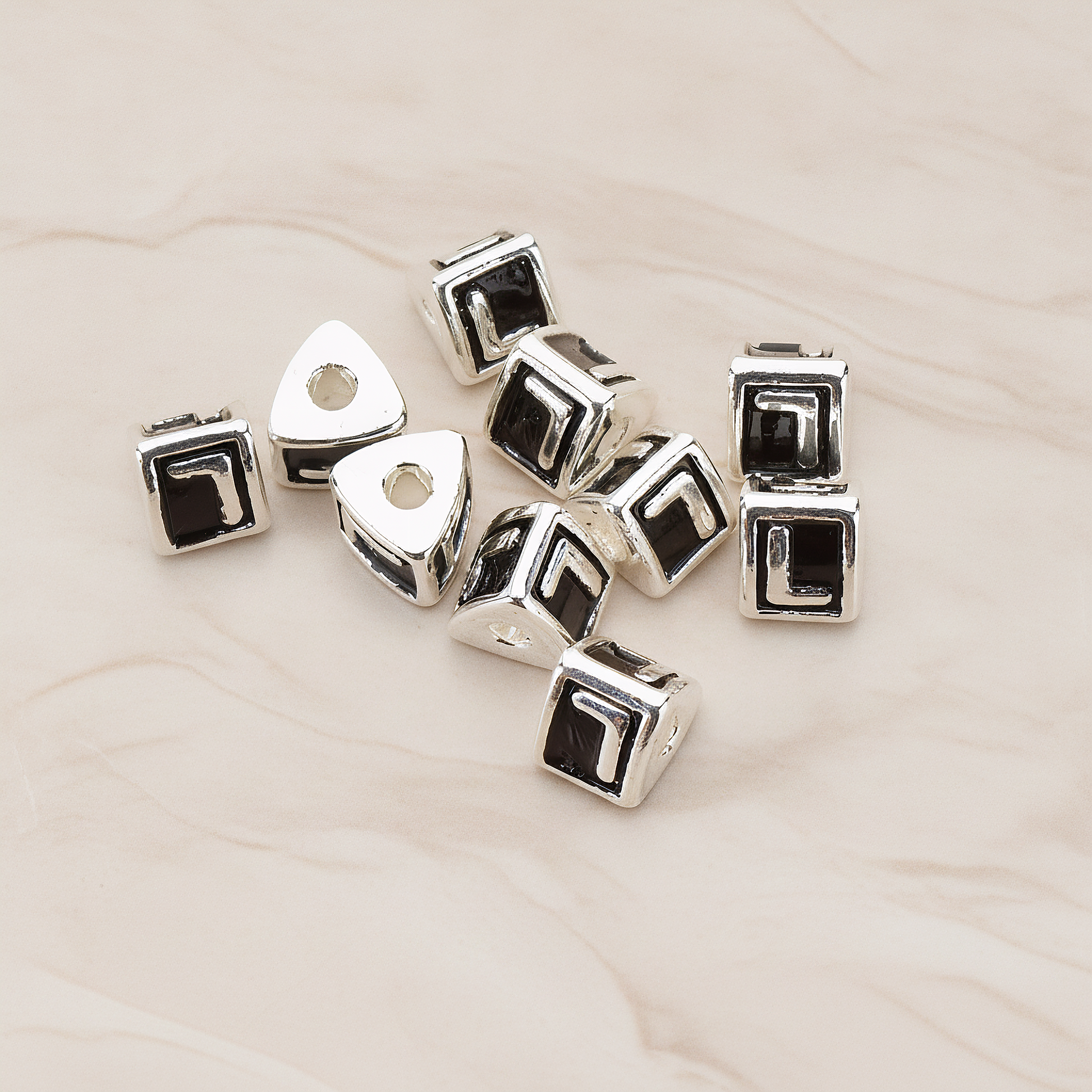 Triangle Cube Initial Metal Bead, 2 Pc on warm marble background (PD.1136)
