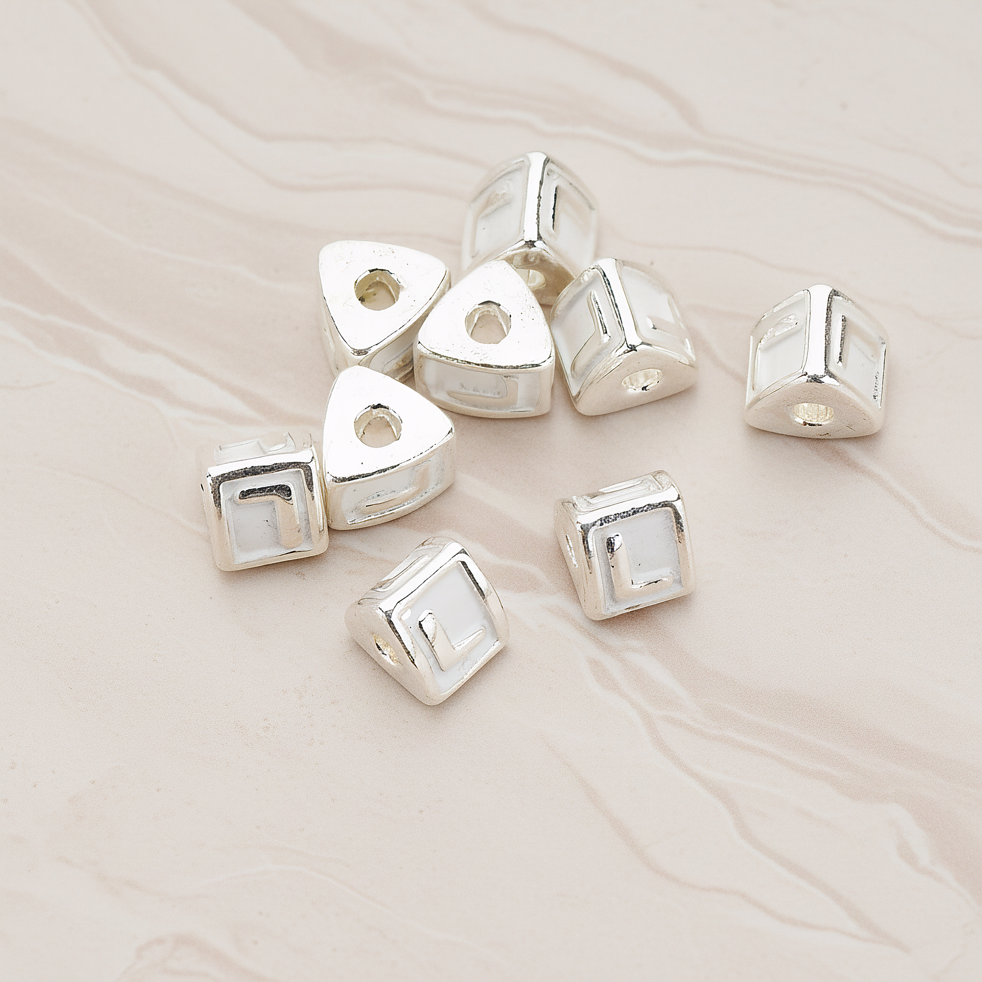 Triangle Cube Initial Metal Bead, 2 Pc on warm marble background (PD.1136)