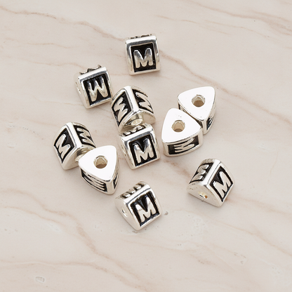 Triangle Cube Initial Metal Bead, 2 Pc on warm marble background (PD.1136)