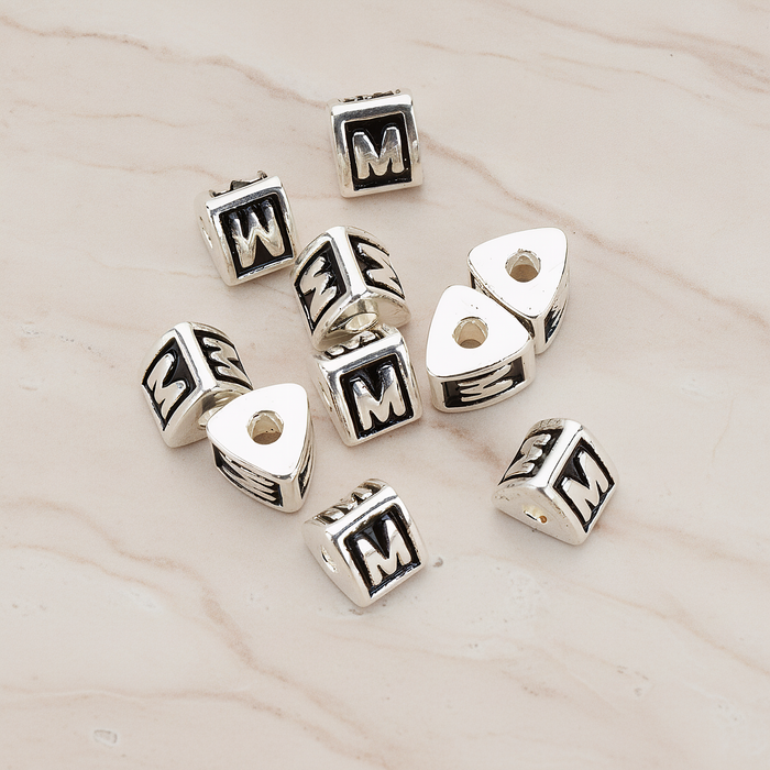 Triangle Cube Initial Metal Bead, 2 Pc on warm marble background (PD.1136)