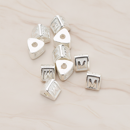 Triangle Cube Initial Metal Bead, 2 Pc on warm marble background (PD.1136)