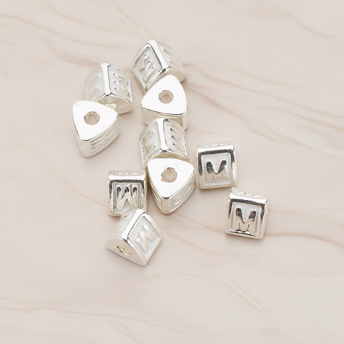 Triangle Cube Initial Metal Bead, 2 Pc on warm marble background (PD.1136)
