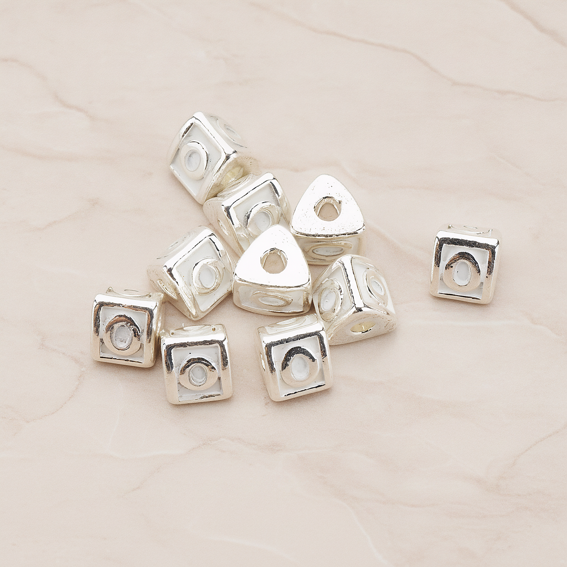 Triangle Cube Initial Metal Bead, 2 Pc on warm marble background (PD.1136)