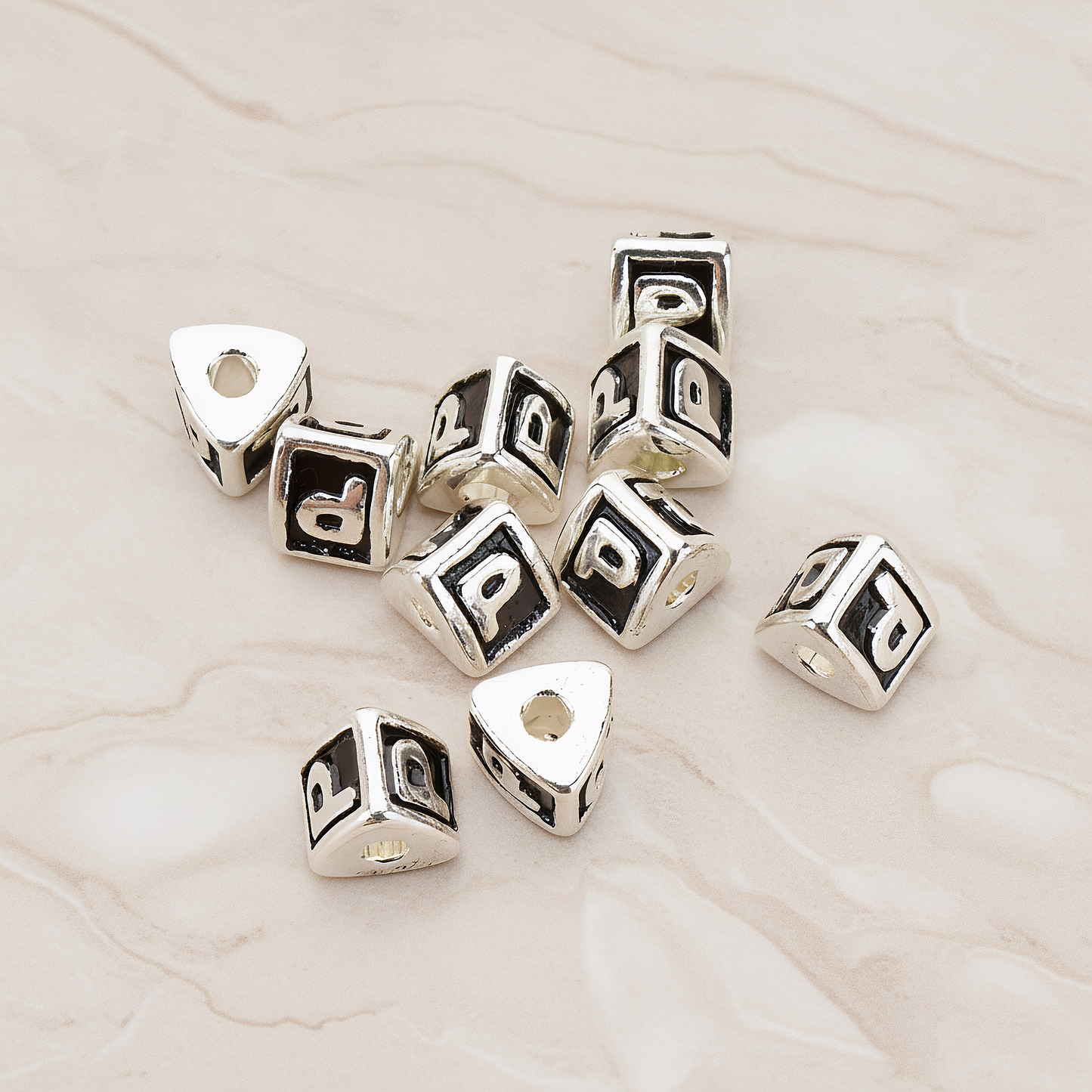 Triangle Cube Initial Metal Bead, 2 Pc on warm marble background (PD.1136)