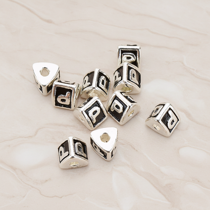 Triangle Cube Initial Metal Bead, 2 Pc on warm marble background (PD.1136)