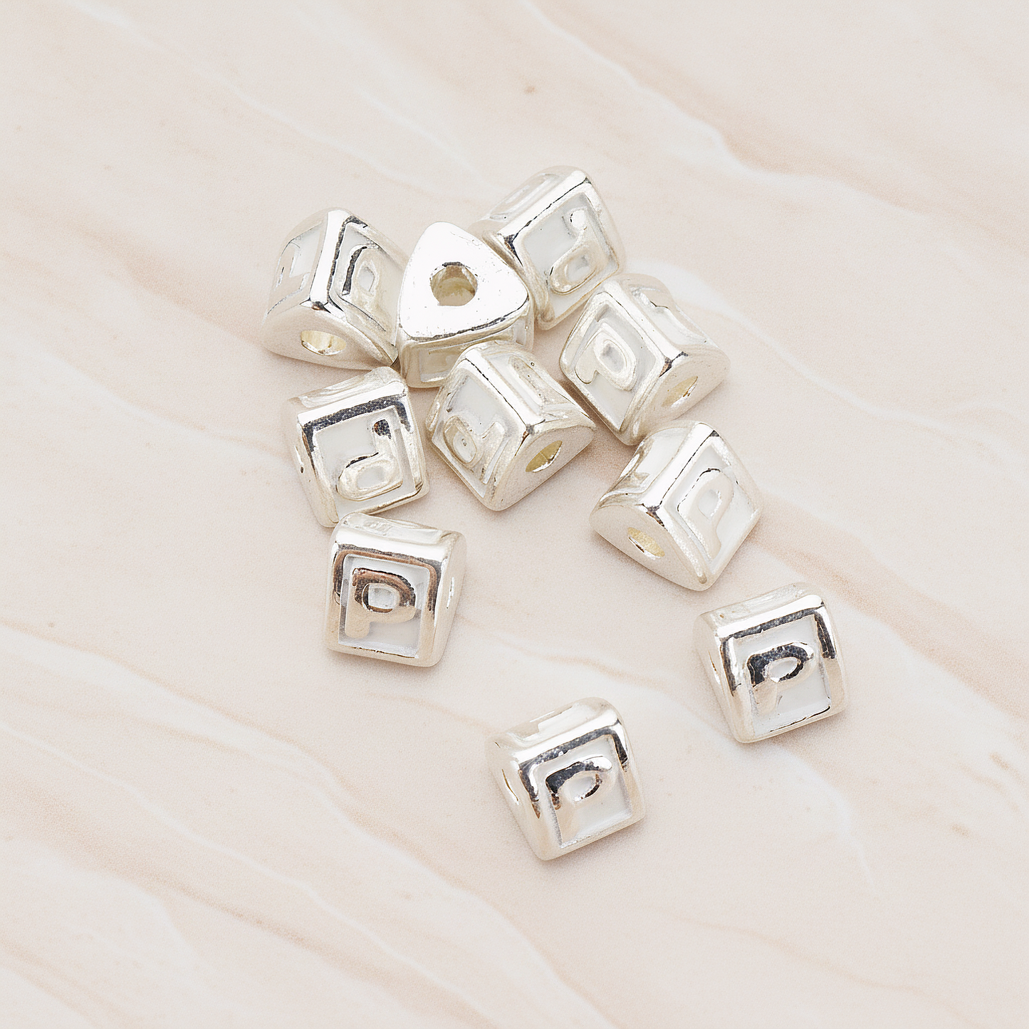 Triangle Cube Initial Metal Bead, 2 Pc on warm marble background (PD.1136)