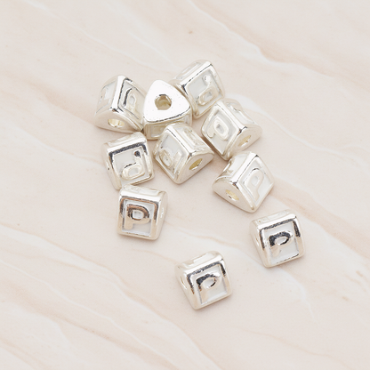 Triangle Cube Initial Metal Bead, 2 Pc on warm marble background (PD.1136)