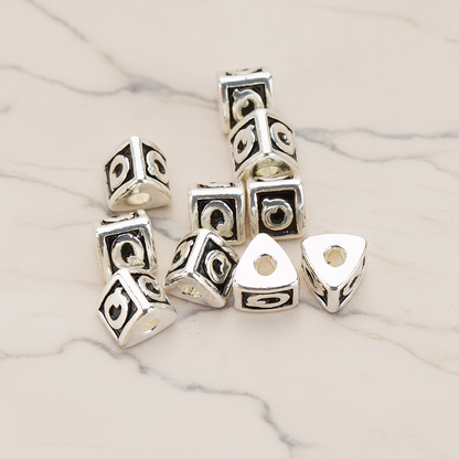 Triangle Cube Initial Metal Bead, 2 Pc on warm marble background (PD.1136)