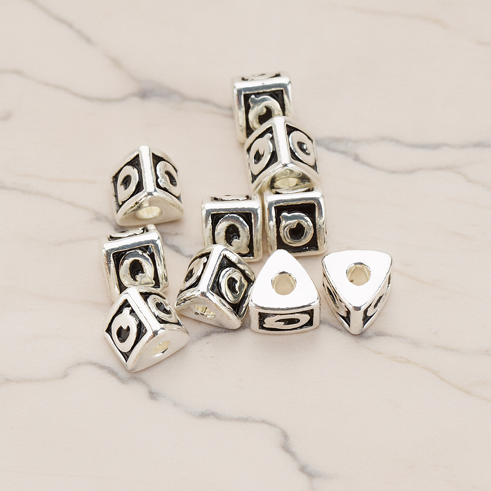 Triangle Cube Initial Metal Bead, 2 Pc on warm marble background (PD.1136)