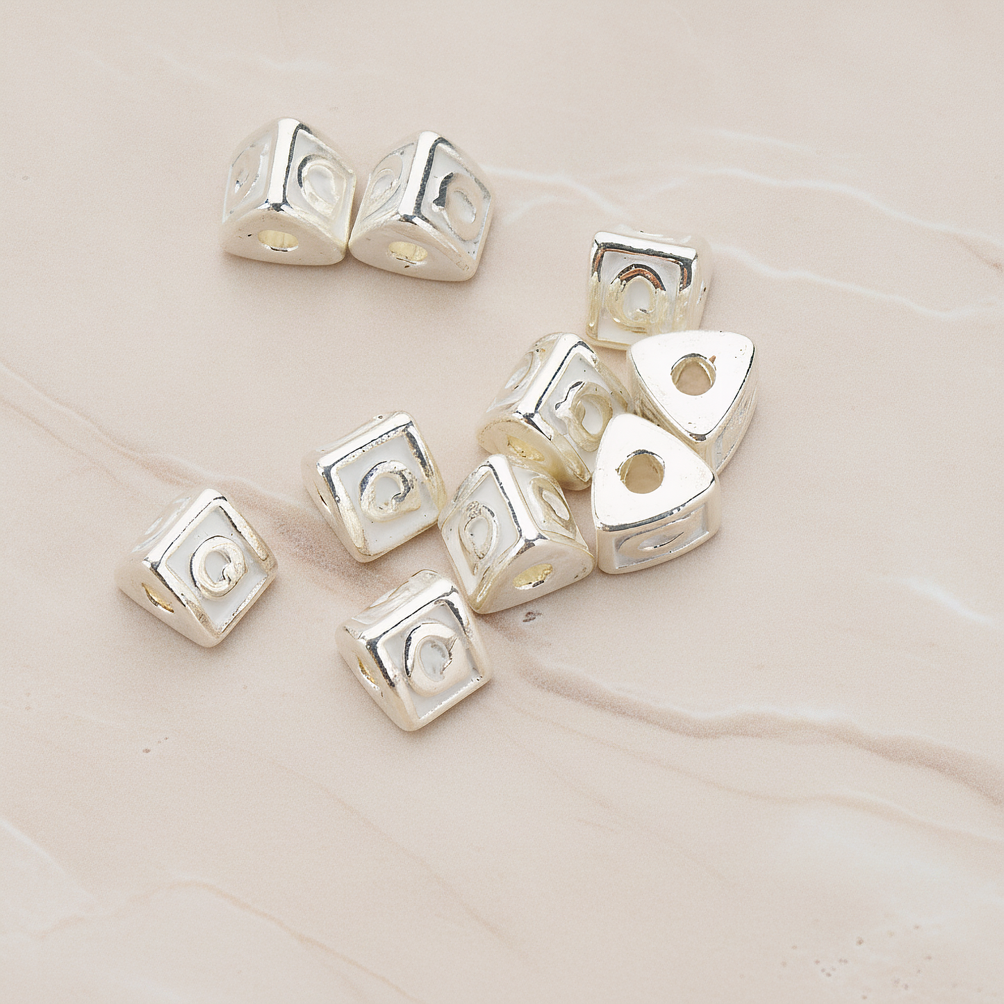 Triangle Cube Initial Metal Bead, 2 Pc on warm marble background (PD.1136)