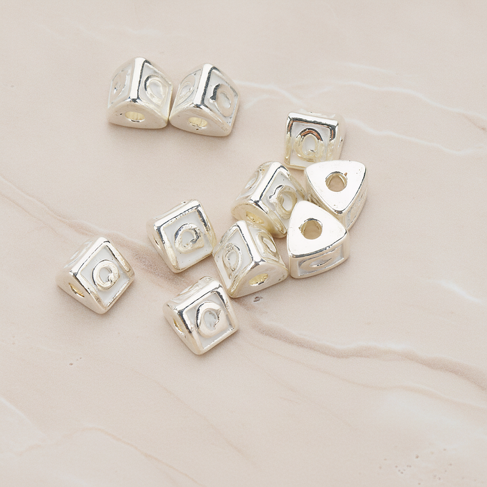 Triangle Cube Initial Metal Bead, 2 Pc on warm marble background (PD.1136)