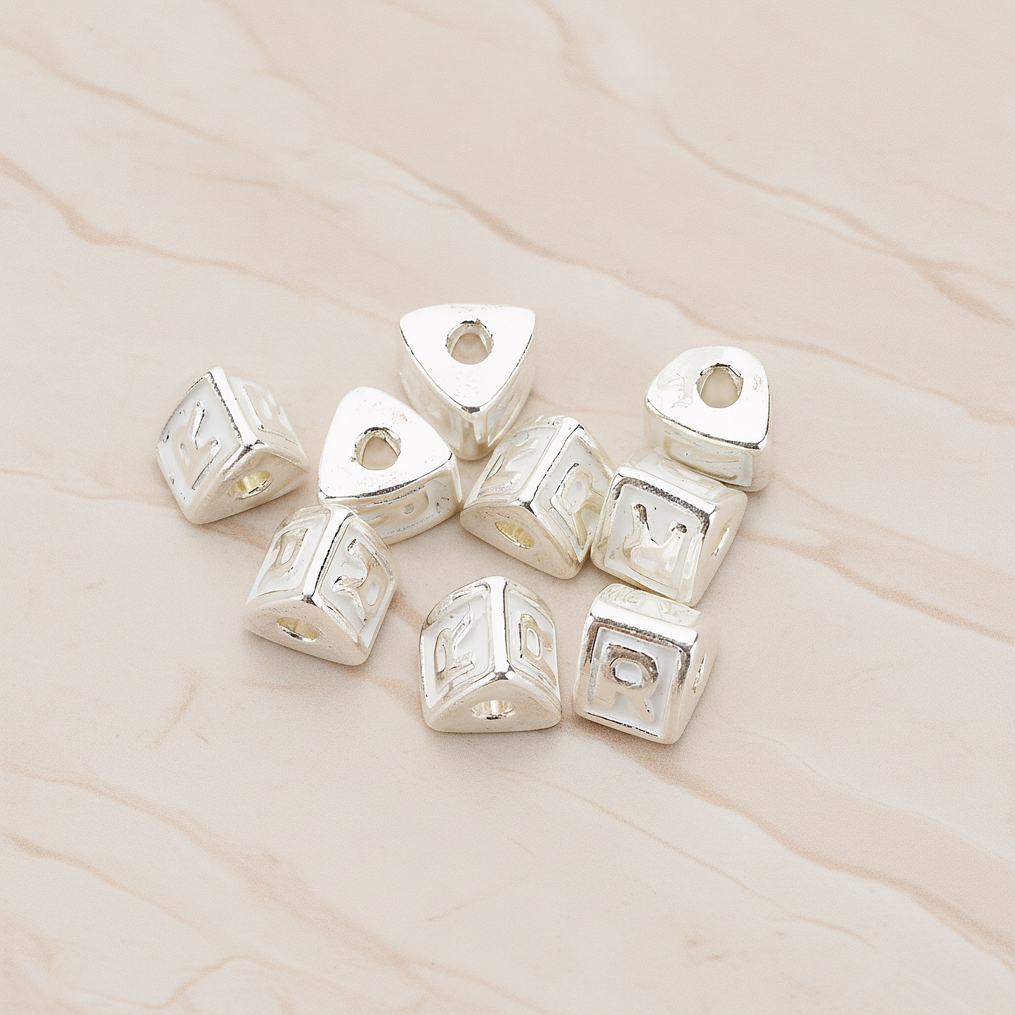 Triangle Cube Initial Metal Bead, 2 Pc on warm marble background (PD.1136)