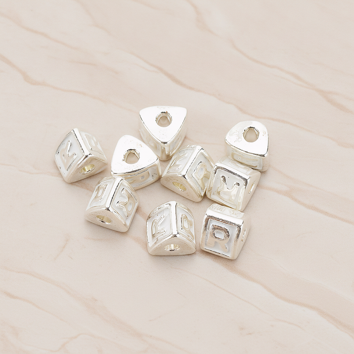 Triangle Cube Initial Metal Bead, 2 Pc on warm marble background (PD.1136)