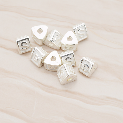 Triangle Cube Initial Metal Bead, 2 Pc on warm marble background (PD.1136)