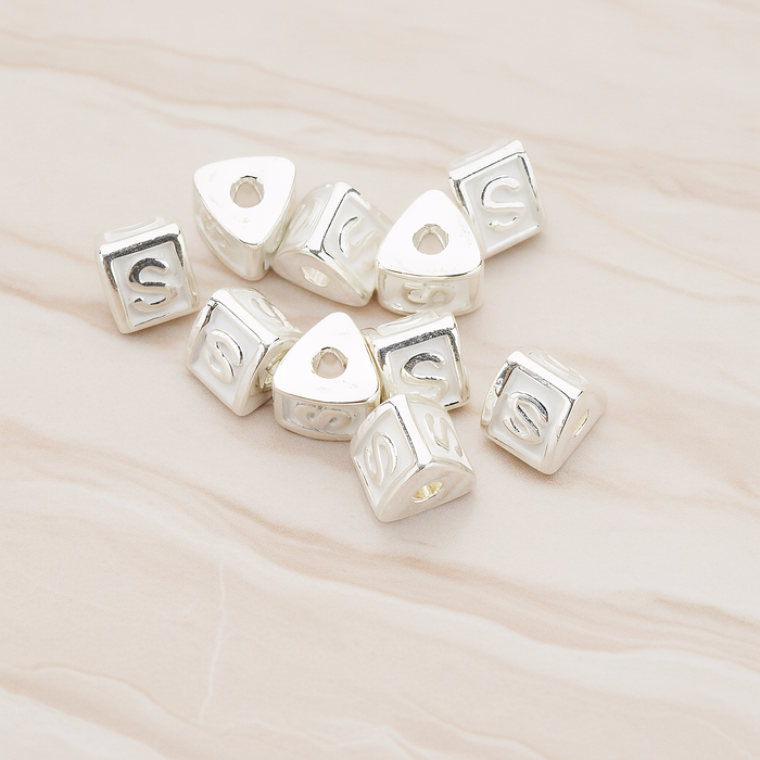 Triangle Cube Initial Metal Bead, 2 Pc on warm marble background (PD.1136)