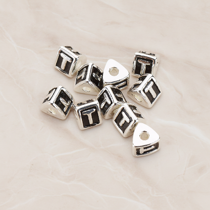 Triangle Cube Initial Metal Bead, 2 Pc on warm marble background (PD.1136)