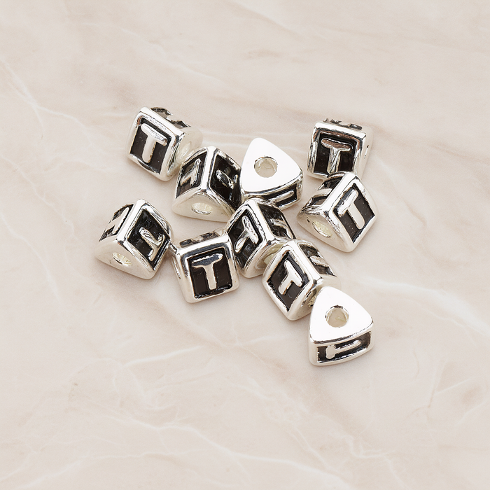Triangle Cube Initial Metal Bead, 2 Pc on warm marble background (PD.1136)