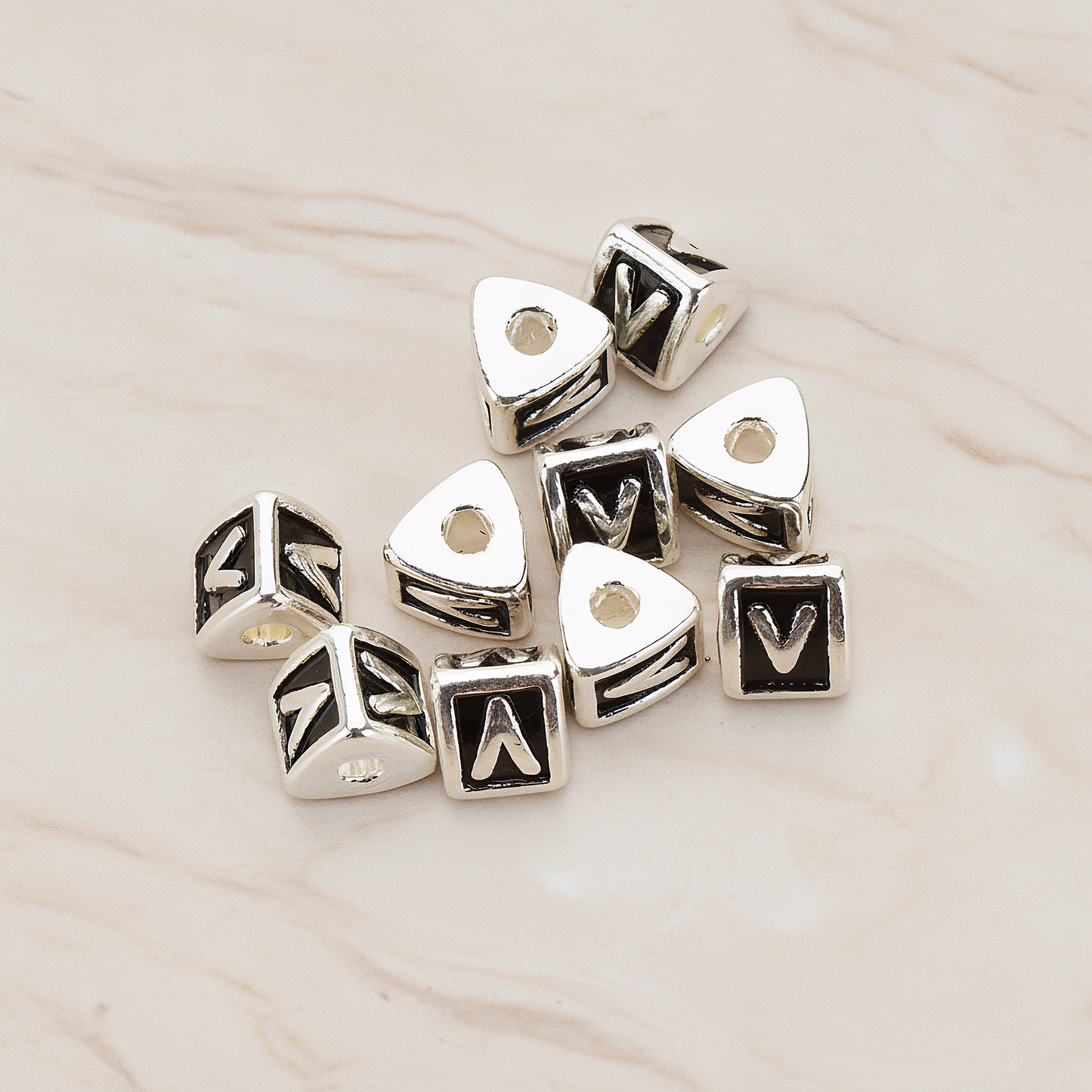 Triangle Cube Initial Metal Bead, 2 Pc on warm marble background (PD.1136)