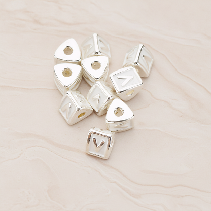 Triangle Cube Initial Metal Bead, 2 Pc on warm marble background (PD.1136)
