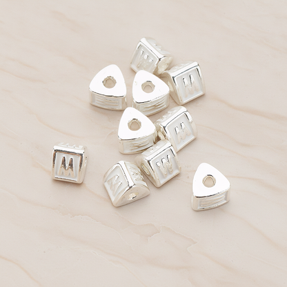 Triangle Cube Initial Metal Bead, 2 Pc on warm marble background (PD.1136)