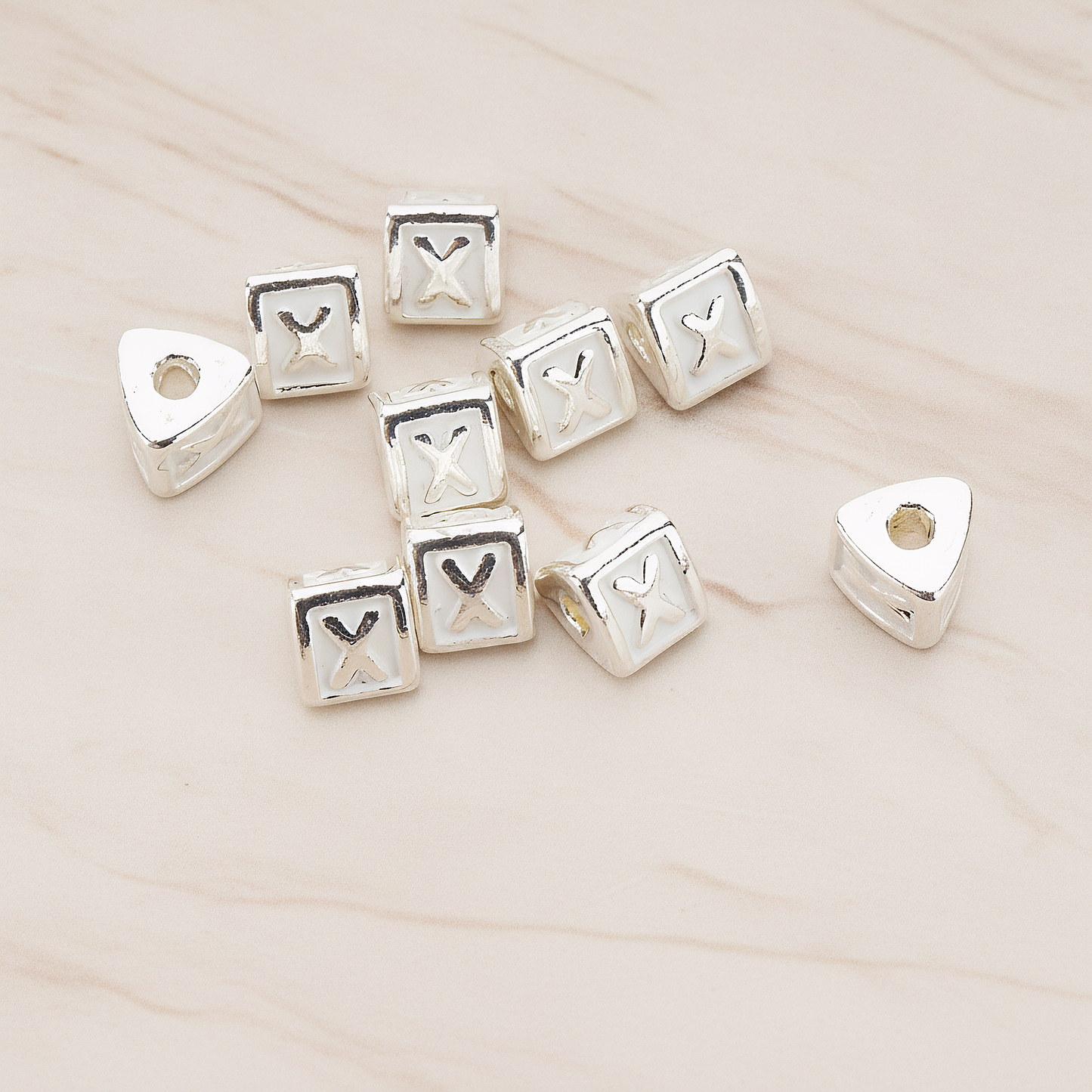 Triangle Cube Initial Metal Bead, 2 Pc on warm marble background (PD.1136)