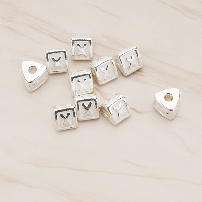 Triangle Cube Initial Metal Bead, 2 Pc on warm marble background (PD.1136)