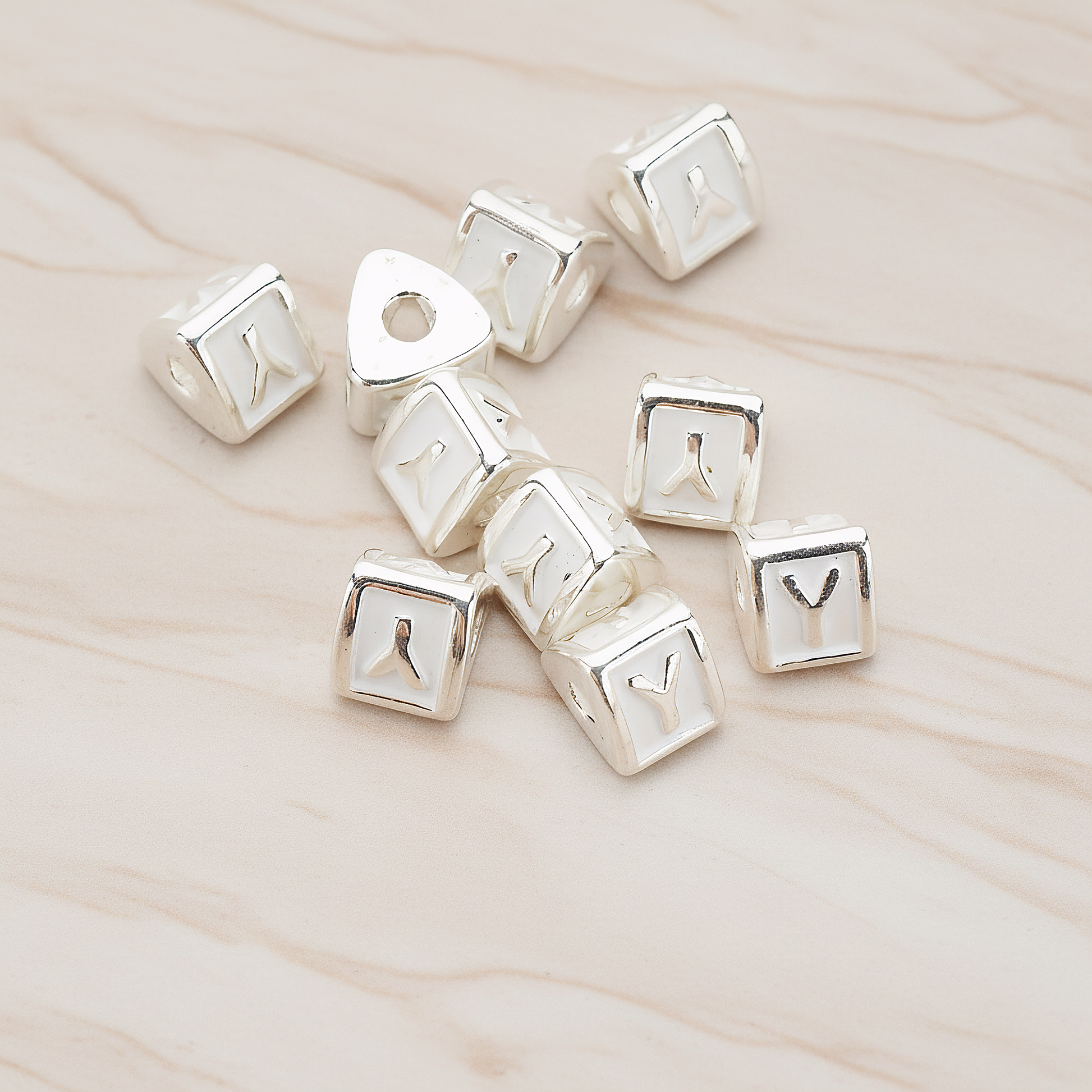 Triangle Cube Initial Metal Bead, 2 Pc on warm marble background (PD.1136)
