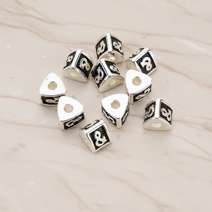 Triangle Cube Initial Metal Bead, 2 Pc on warm marble background (PD.1136)