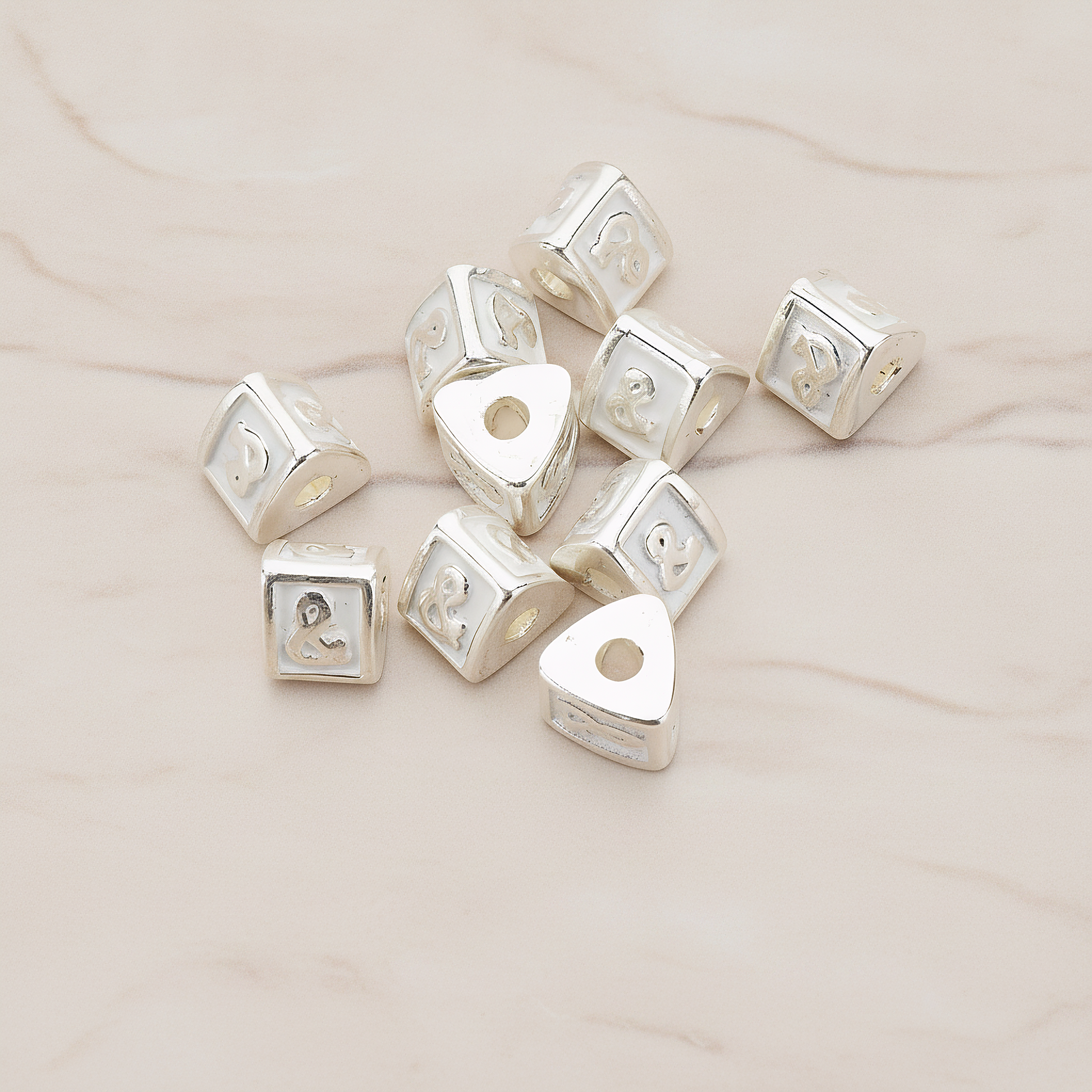 Triangle Cube Initial Metal Bead, 2 Pc on warm marble background (PD.1136)