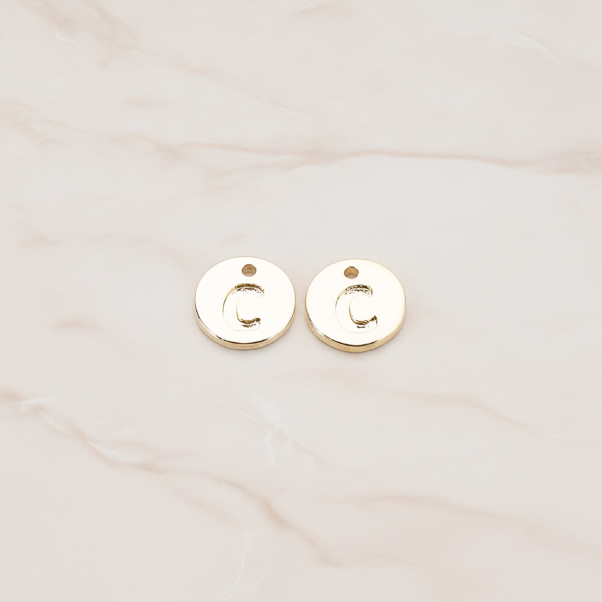Round Disk Initial Pendant, 2 Pc on warm marble background (PD.219)