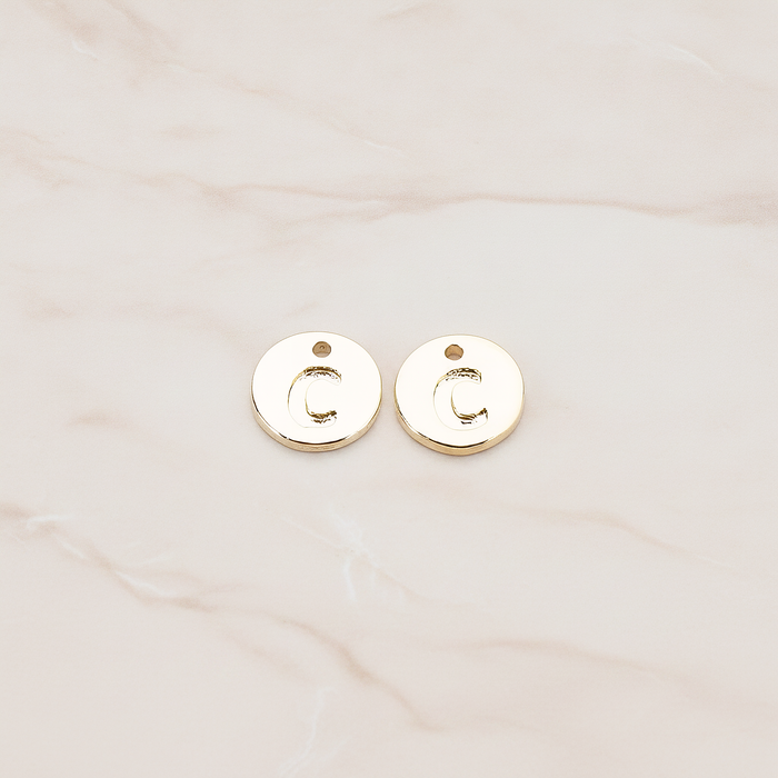 Round Disk Initial Pendant, 2 Pc on warm marble background (PD.219)
