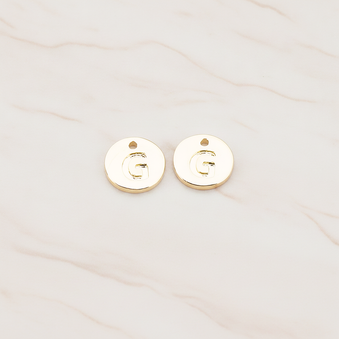 Round Disk Initial Pendant, 2 Pc on warm marble background (PD.219)