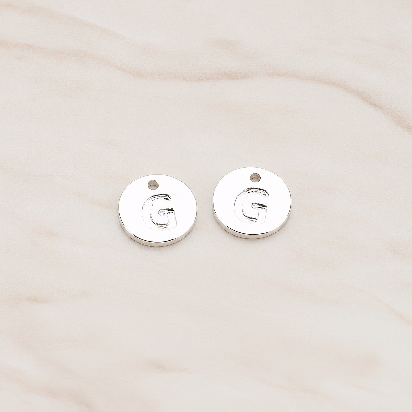 Round Disk Initial Pendant, 2 Pc on warm marble background (PD.219)