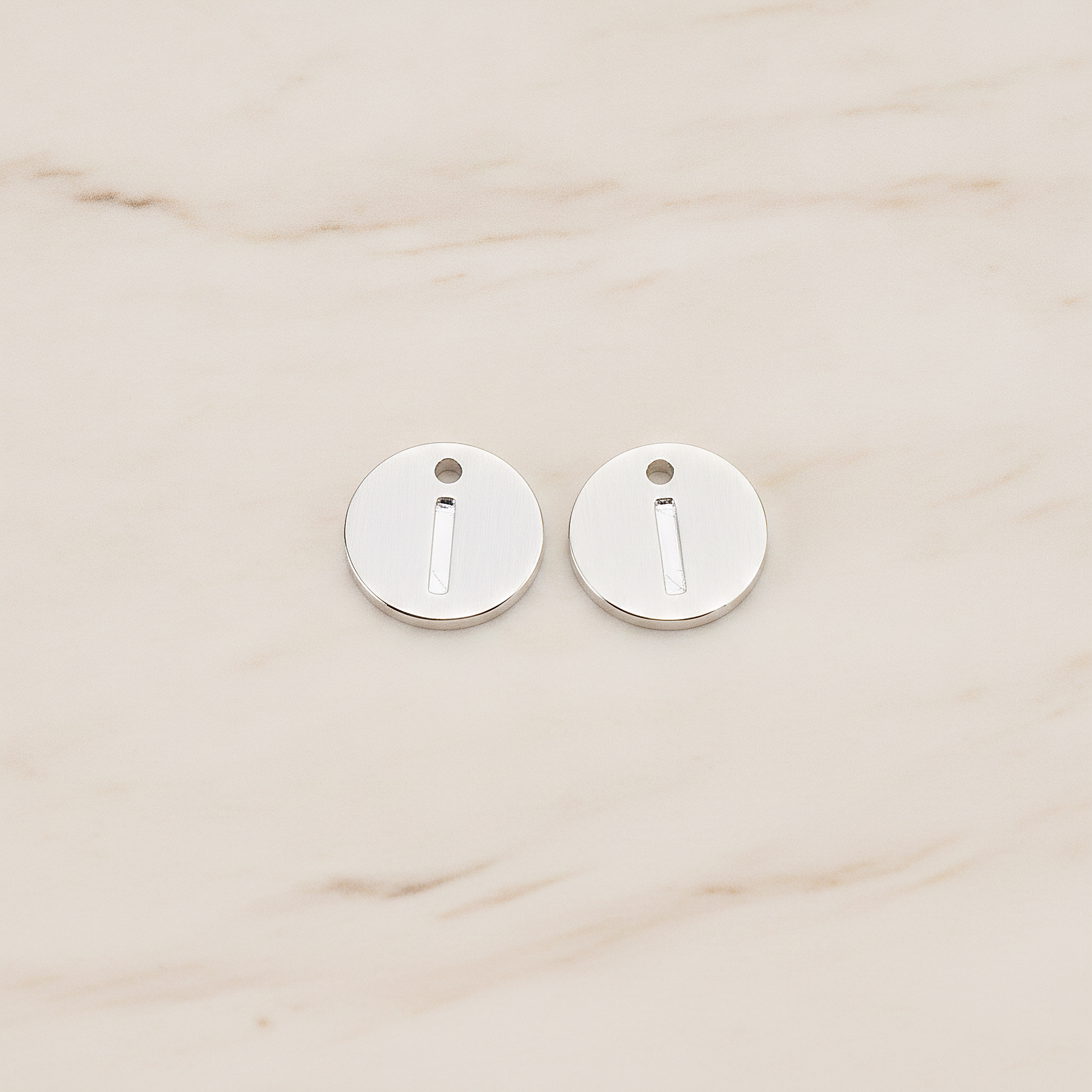 Round Disk Initial Pendant, 2 Pc on warm marble background (PD.219)