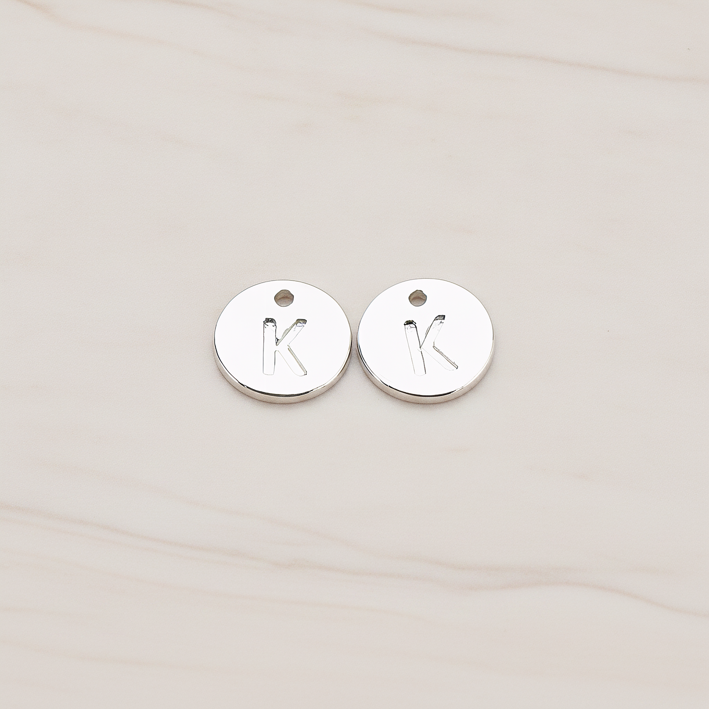Round Disk Initial Pendant, 2 Pc on warm marble background (PD.219)