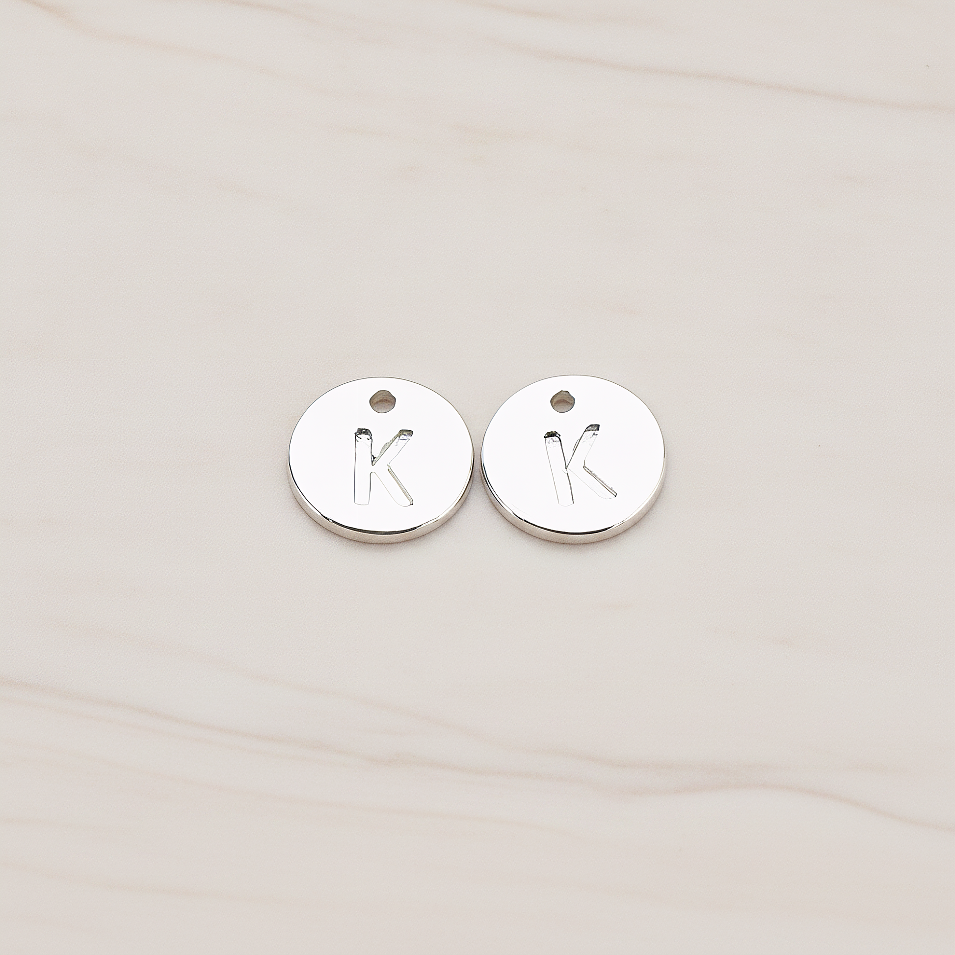 Round Disk Initial Pendant, 2 Pc on warm marble background (PD.219)
