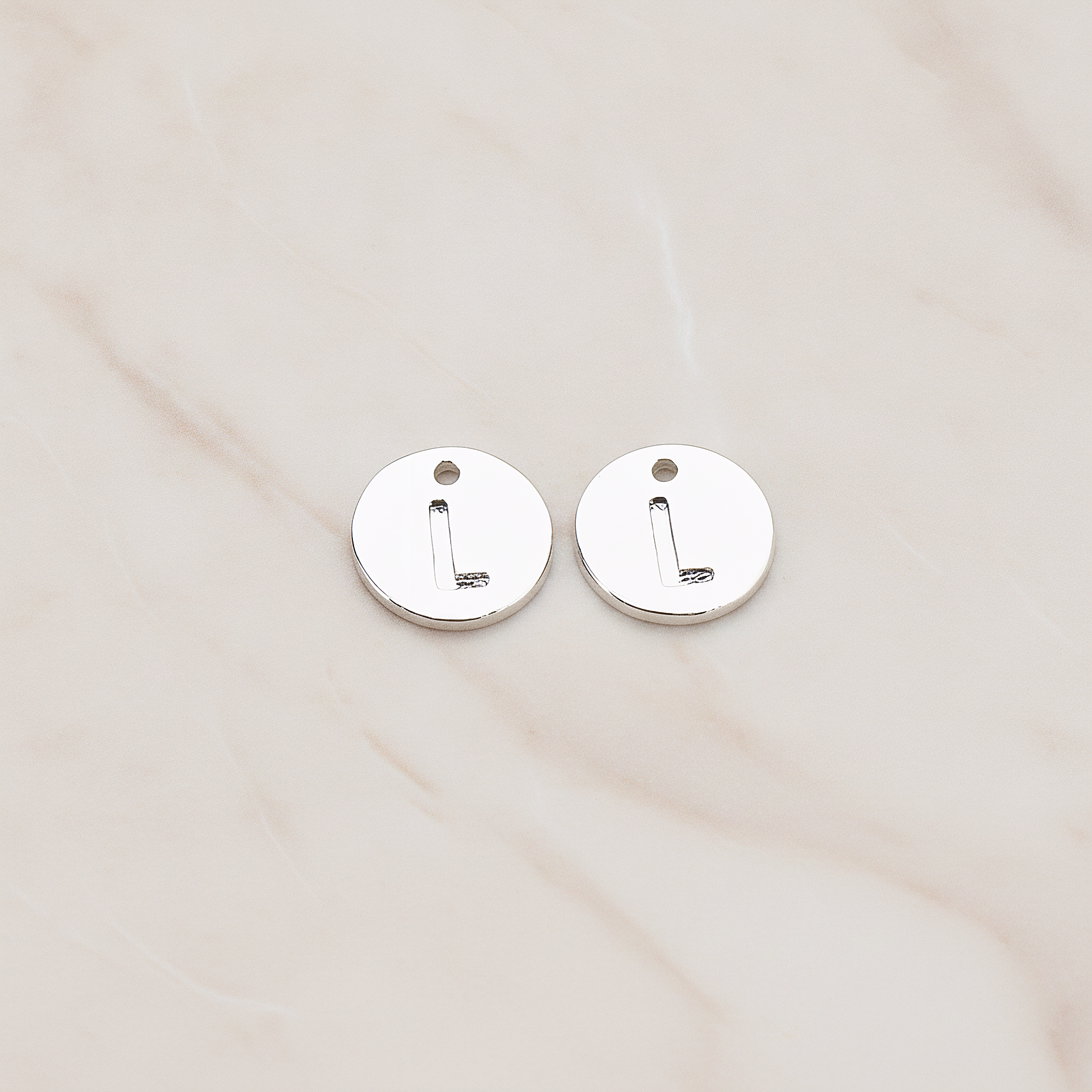 Round Disk Initial Pendant, 2 Pc on warm marble background (PD.219)