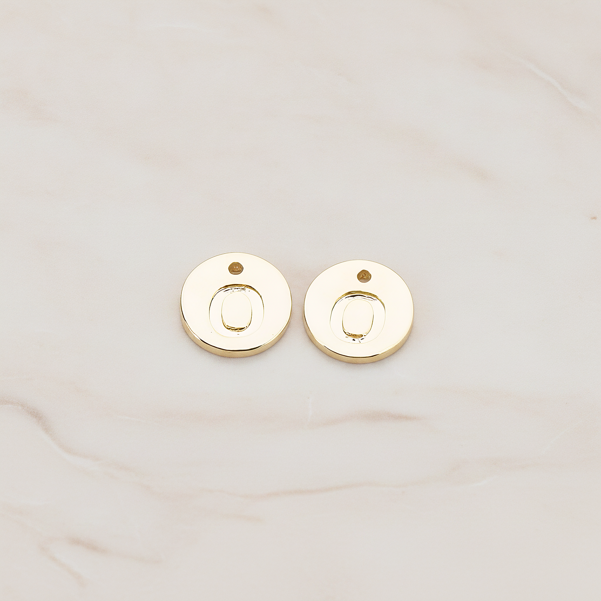 Round Disk Initial Pendant, 2 Pc on warm marble background (PD.219)