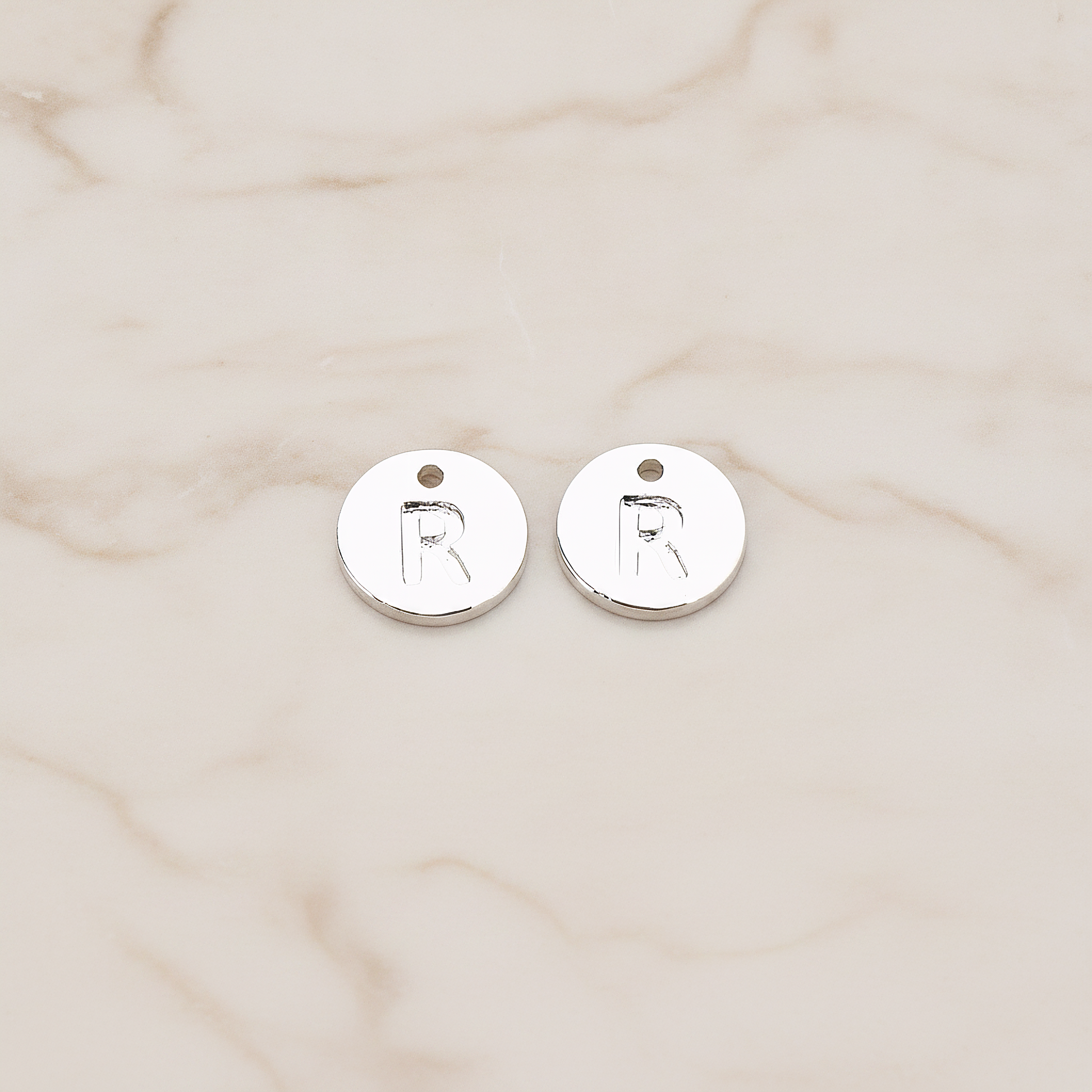 Round Disk Initial Pendant, 2 Pc on warm marble background (PD.219)