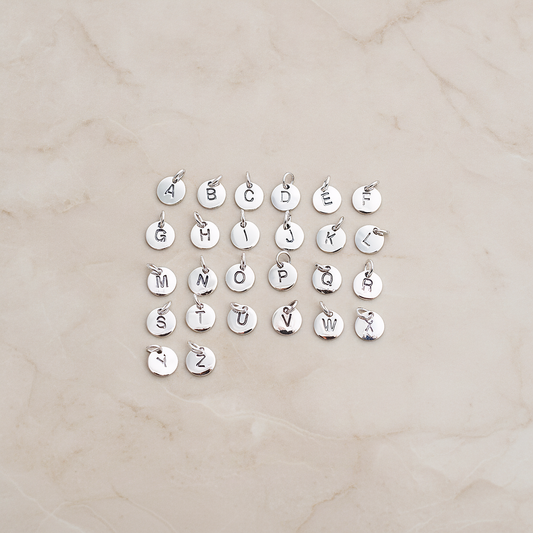 925 Silver Round Initial Stamped with Jumpring on Pendant, 1 Pc on warm marble background (PD.078)