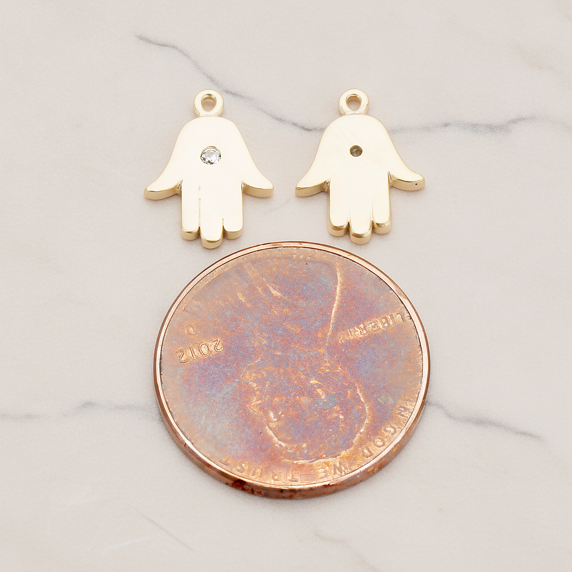 Cubic Setting Hamsa Pendant, 2 Pc on warm marble background (PD.1018)