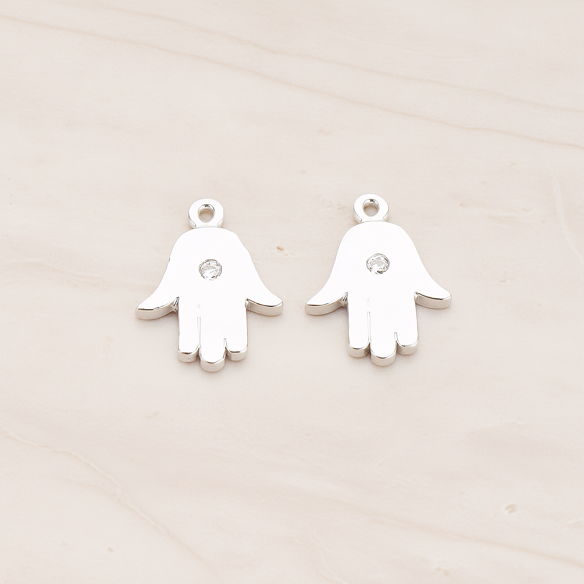Cubic Setting Hamsa Pendant, 2 Pc on warm marble background (PD.1018)